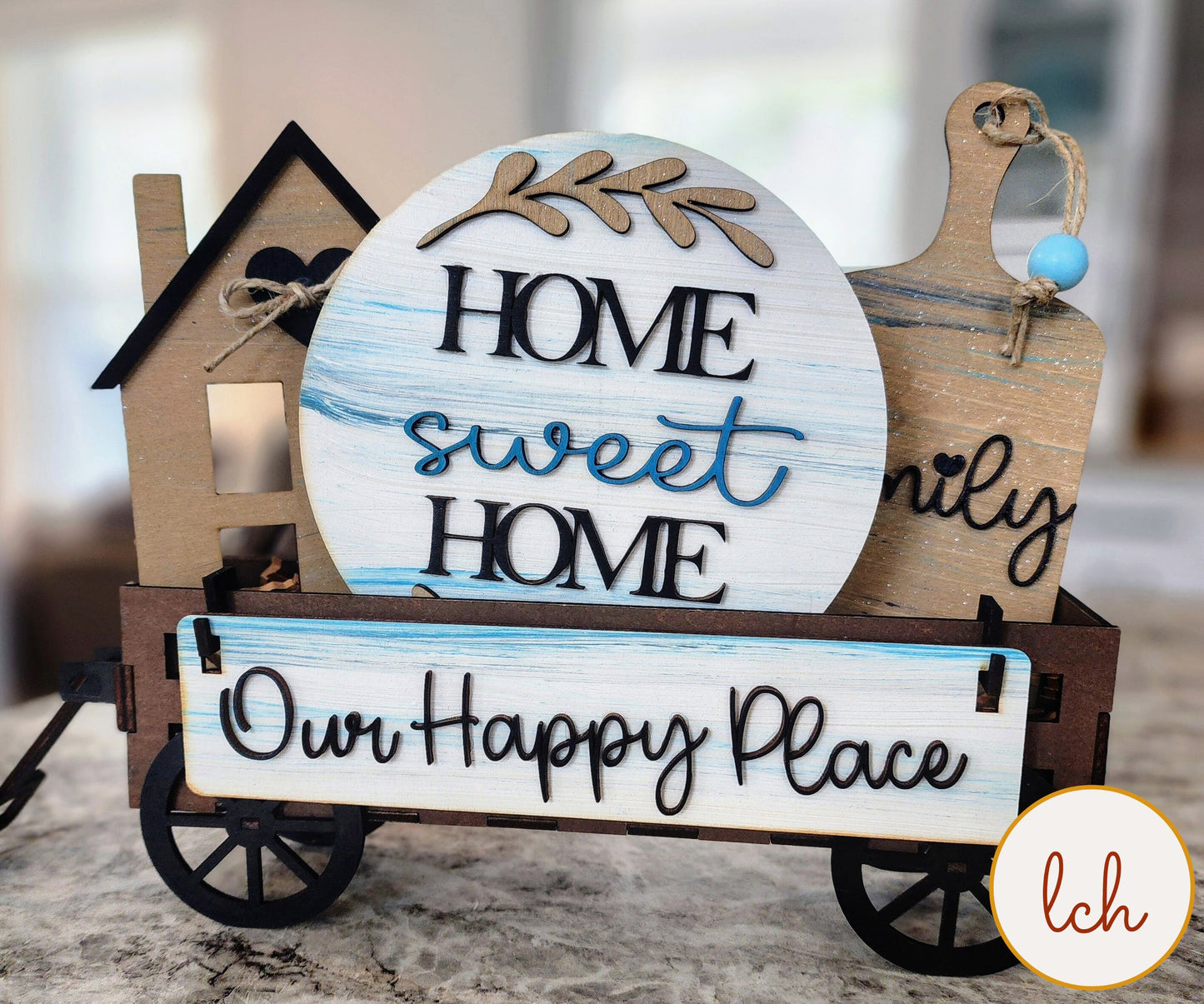 Wooden wagon insert from My Store with Home Sweet Home and Our Happy Place decorative signs