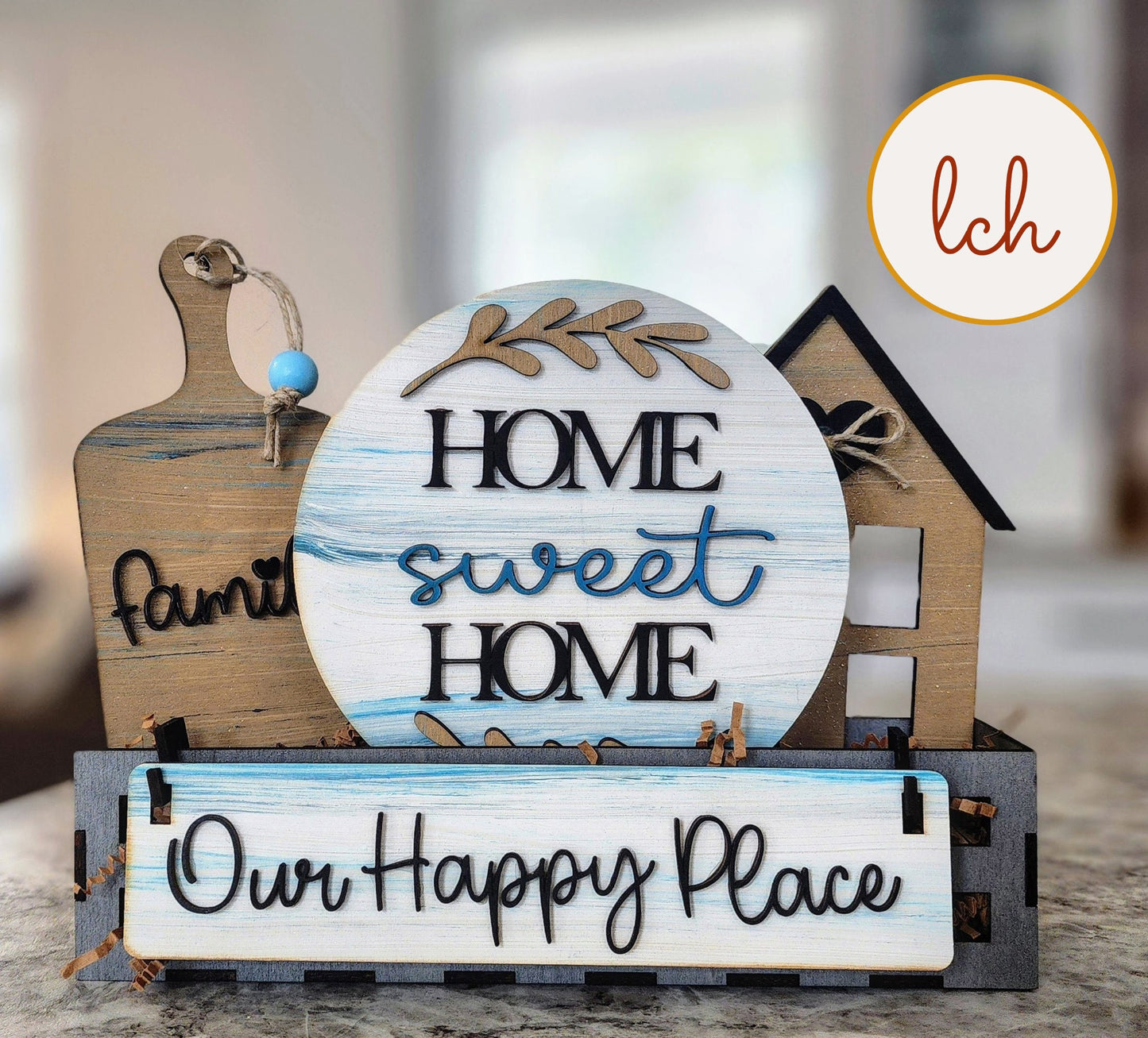 Wooden wagon insert with farmhouse decor including Home Sweet Home round sign and Our Happy Place sign