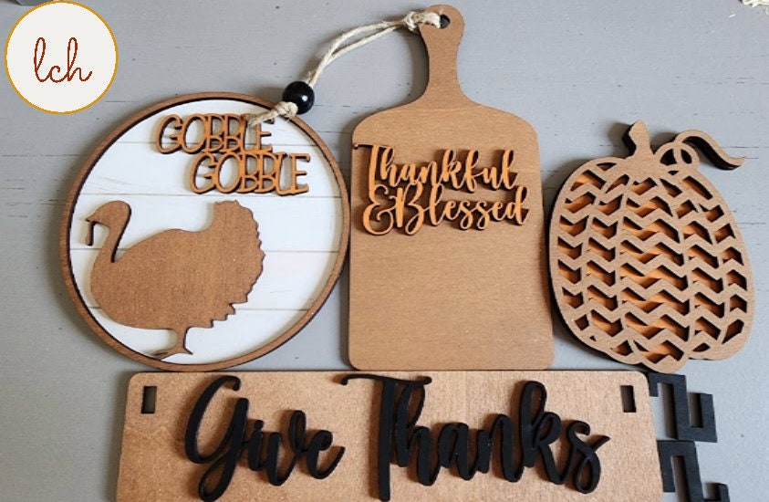Hand painted Thanksgiving wooden decor featuring turkey, pumpkin, cutting board, and Give Thanks sign