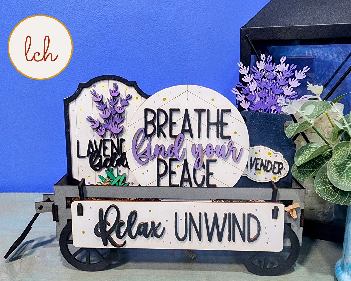 Wooden wagon insert with decorative lavender and signs that say breathe find your peace and relax unwind