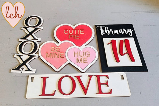 Wooden wagon insert set with love-themed pieces including XOXOX, hearts with messages, February 14 sign, and LOVE plaque