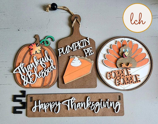 Wooden wagon insert set with Thanksgiving-themed decorations including pumpkin, pumpkin pie, turkey, and Happy Thanksgiving sign