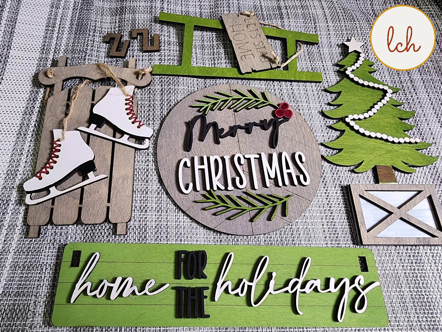 Wooden Christmas shelf sitter insert for farmhouse decor including sled, ice skates, tree, and holiday signs