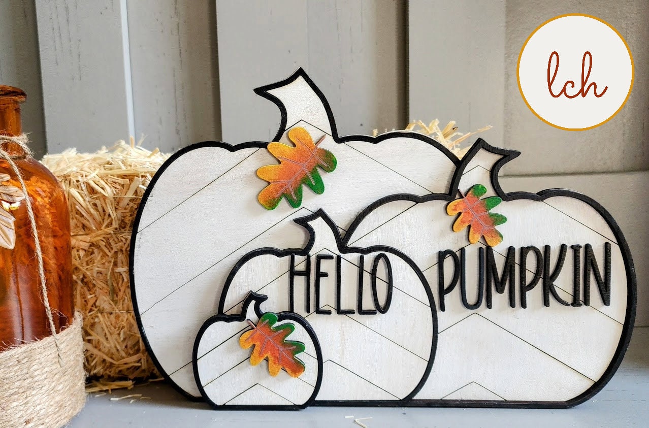 Wooden Hello Pumpkin fall seasonal decor signs with oak leaf accents on white pumpkins