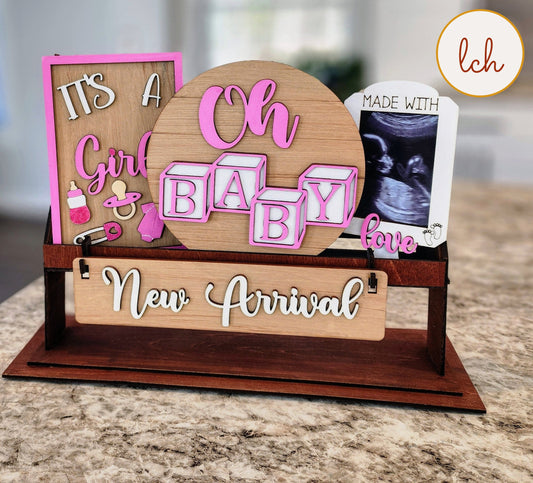 Wooden wagon insert with baby girl theme including Oh Baby blocks and New Arrival sign