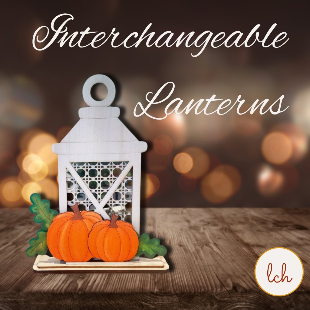 Custom changeable lantern decor featuring three laser-cut wooden lanterns with battery-powered lights on a wooden table