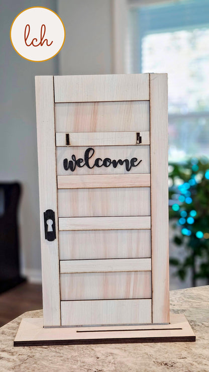 Wooden sign post insert with welcome sign in black script on natural wood from My Store