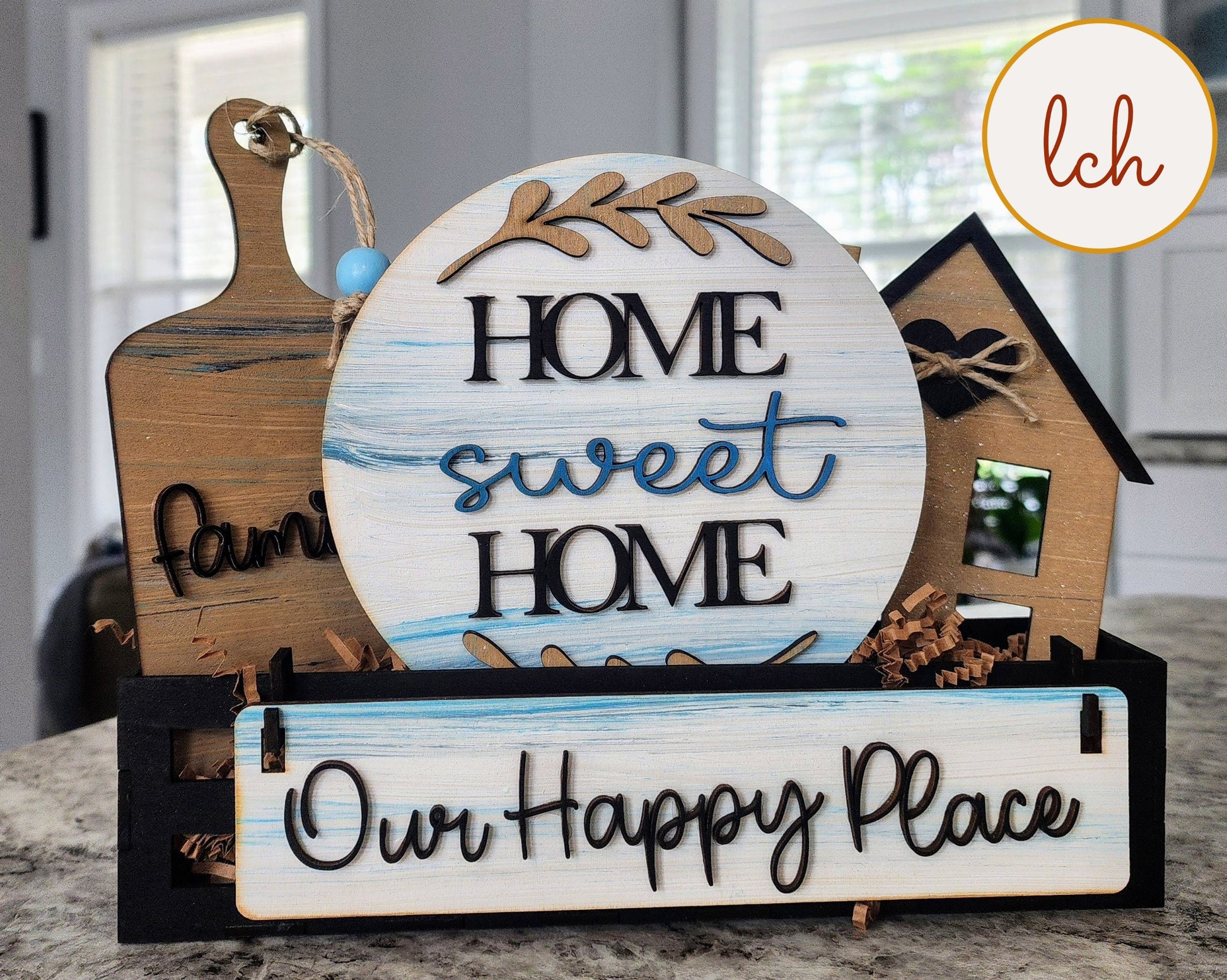 Wooden wagon insert with farmhouse decor including Home Sweet Home round sign and Our Happy Place rectangular sign