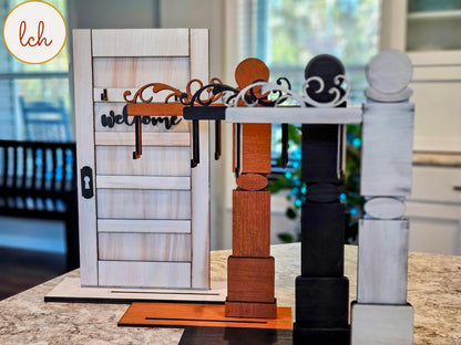 Wooden sign post inserts in white, black, and natural wood colors displayed on a kitchen countertop