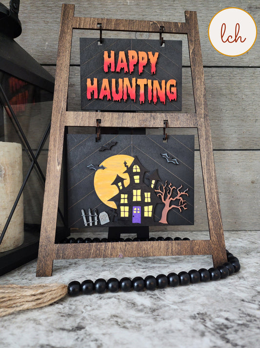 Halloween wooden ladder picture frame with spooky Happy Haunting sign and haunted house decoration