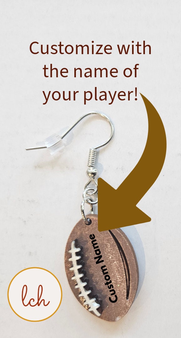 My Store hand painted wooden earrings shaped like a customizable football with a name