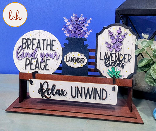 Wooden wagon insert with lavender-themed signs saying breathe and your peace relax unwind