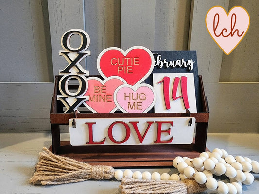 Wooden wagon insert with Valentines Day signs including love and hearts in red pink and white