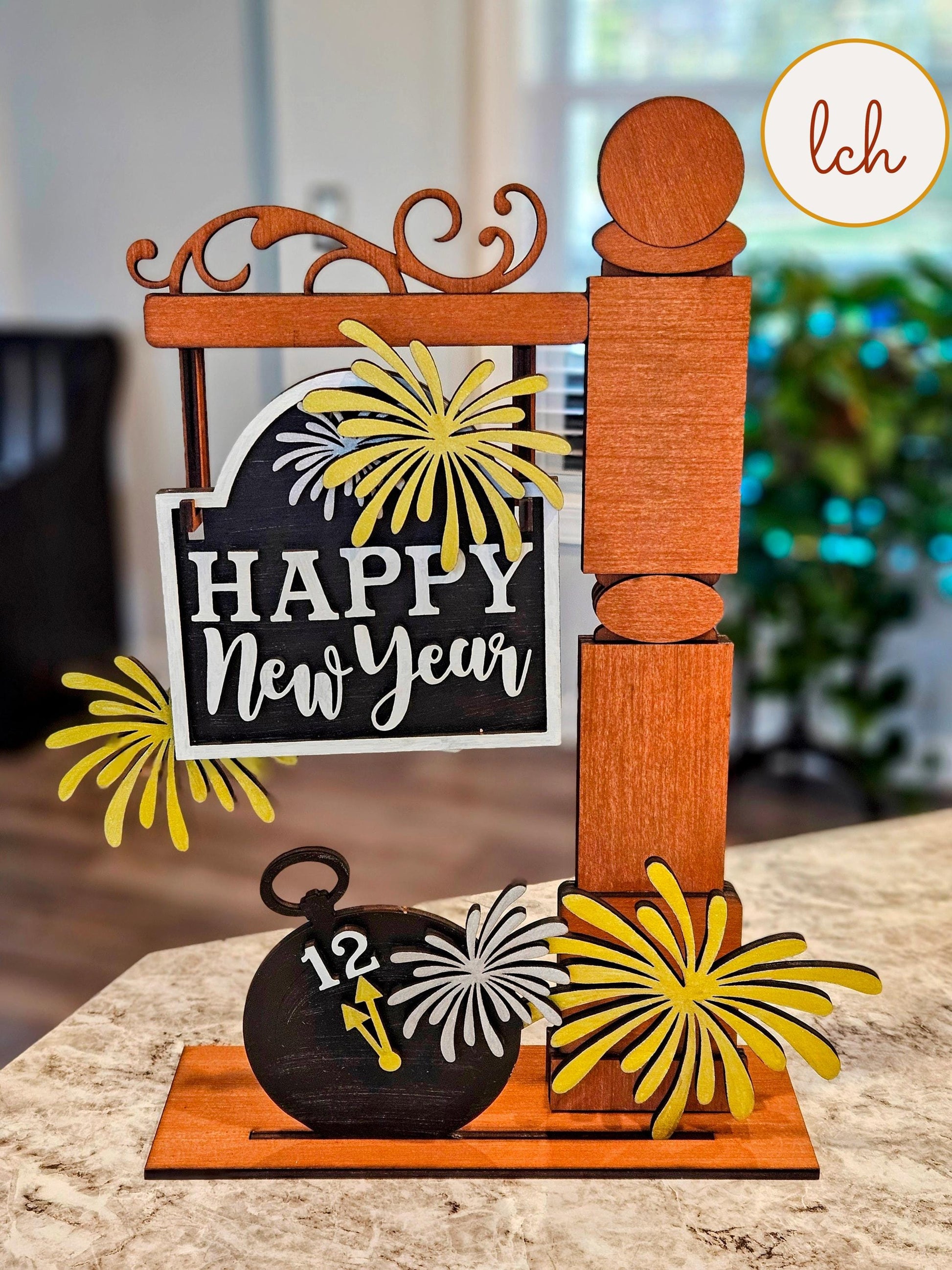 Wooden sign post insert with Happy New Year sign and fireworks decoration on a table