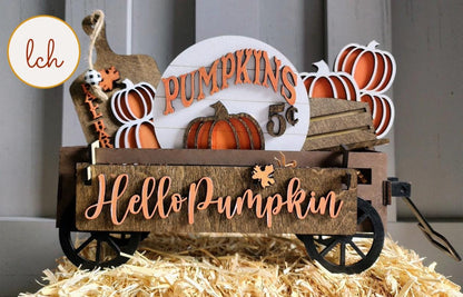 Wooden wagon insert with Hello Pumpkin sign and decorative pumpkins for fall decor