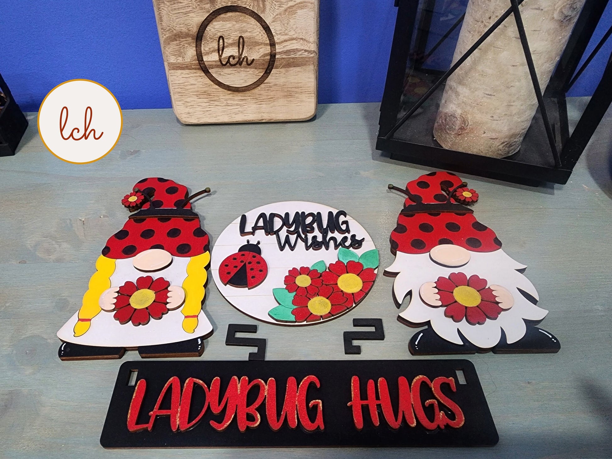 Wooden wagon insert set with ladybug theme featuring gnome figures and floral designs
