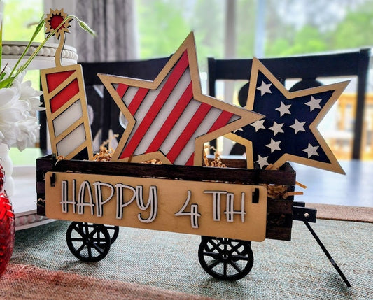 Wooden 4th of July decor insert with patriotic star and candle shapes in red white and blue