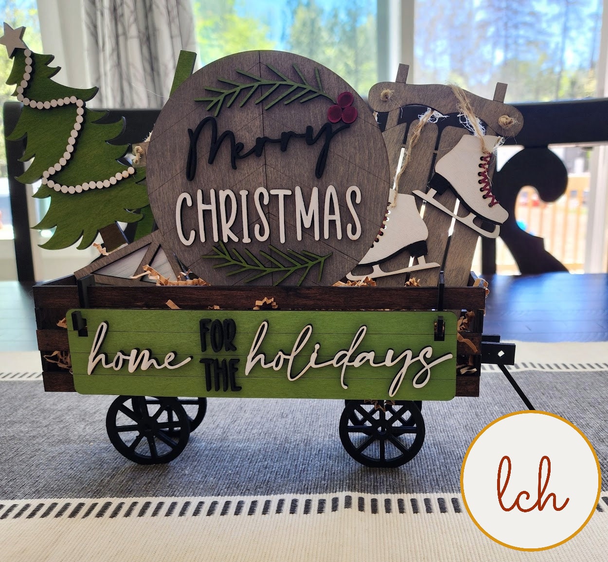 Christmas shelf sitter insert for farmhouse decor featuring wooden holiday themed wagon with ice skates and Christmas tree