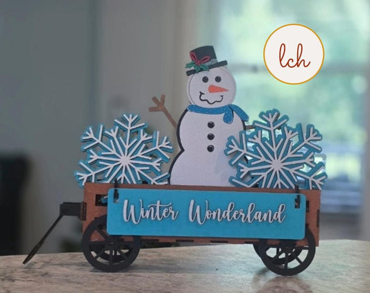 Handcrafted snowman decor for shelves with blue snowflakes and Winter Wonderland sign