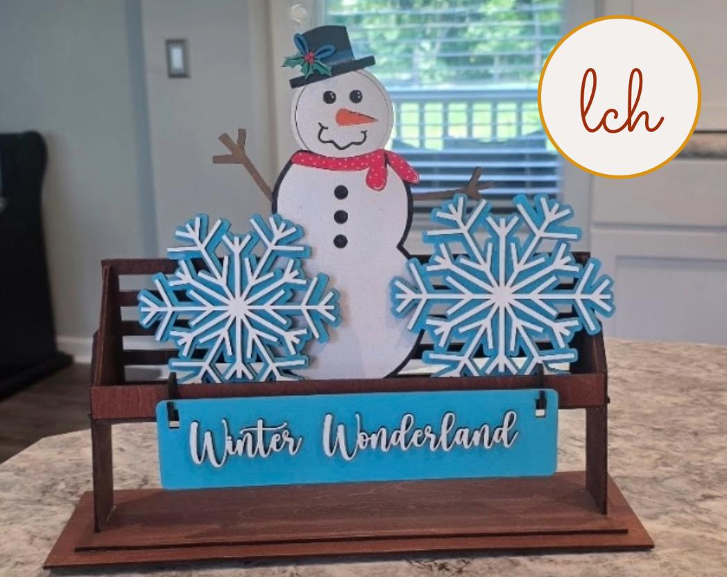 Handcrafted snowman decor for shelves with blue snowflakes and Winter Wonderland sign wooden decoration