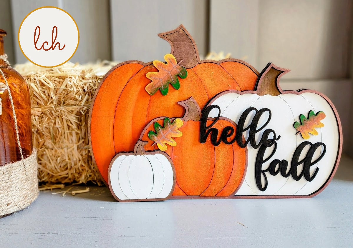 Hello fall wooden pumpkin decor set with orange and white pumpkins and autumn leaves