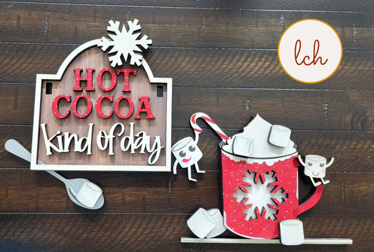 Wooden sign post insert with red text saying hot cocoa kind of day and festive hot cocoa mug with marshmallows