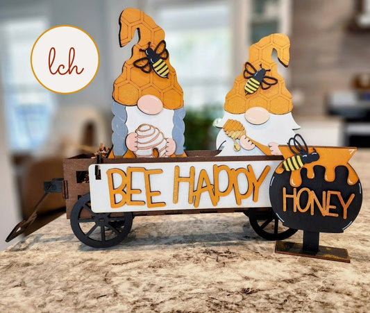 Wooden wagon insert featuring interchangeable gnome décor with bee and honey theme for home decoration