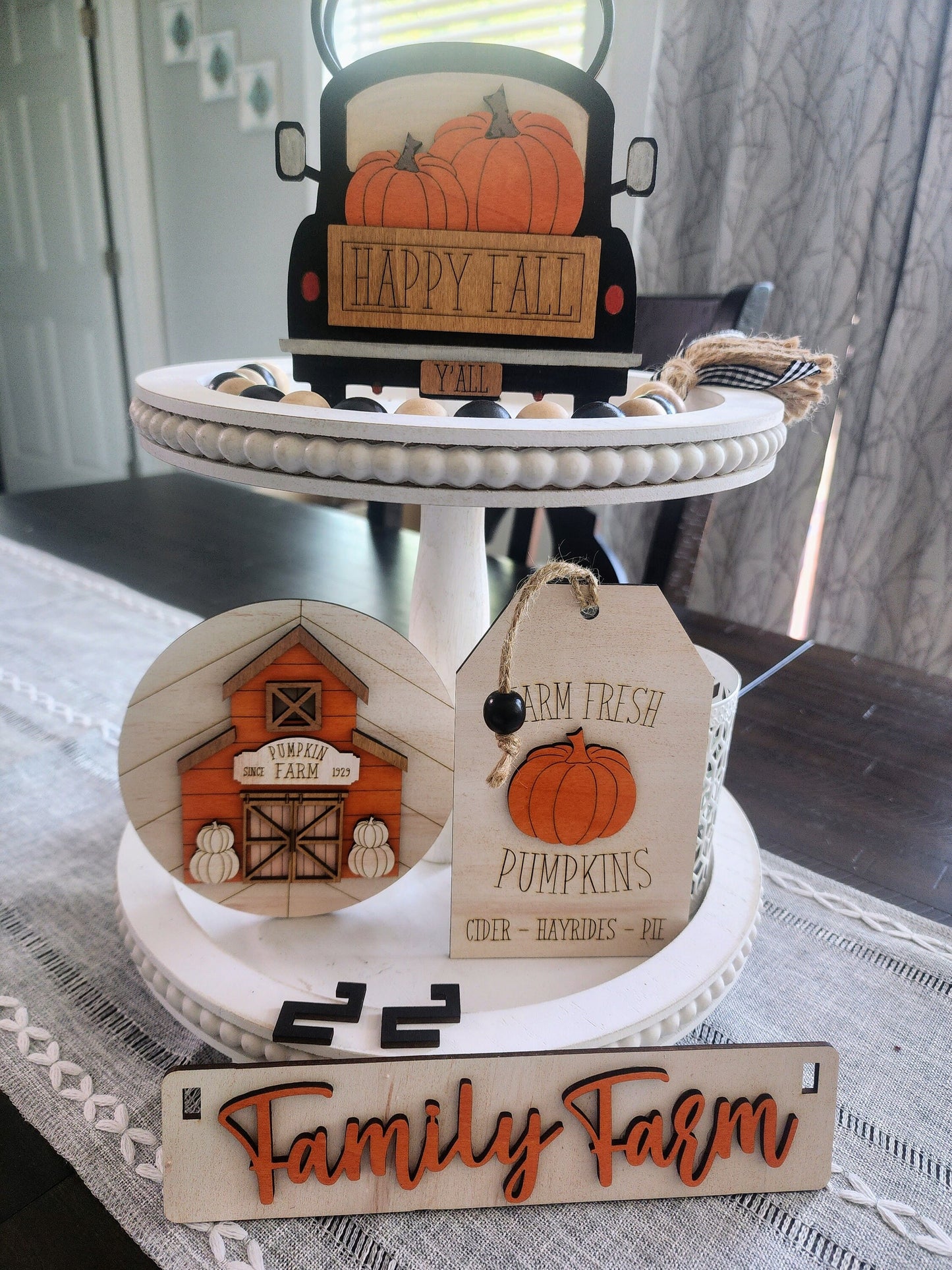 Wooden personalized fall decorations for shelves featuring pumpkins, barn, and family farm design