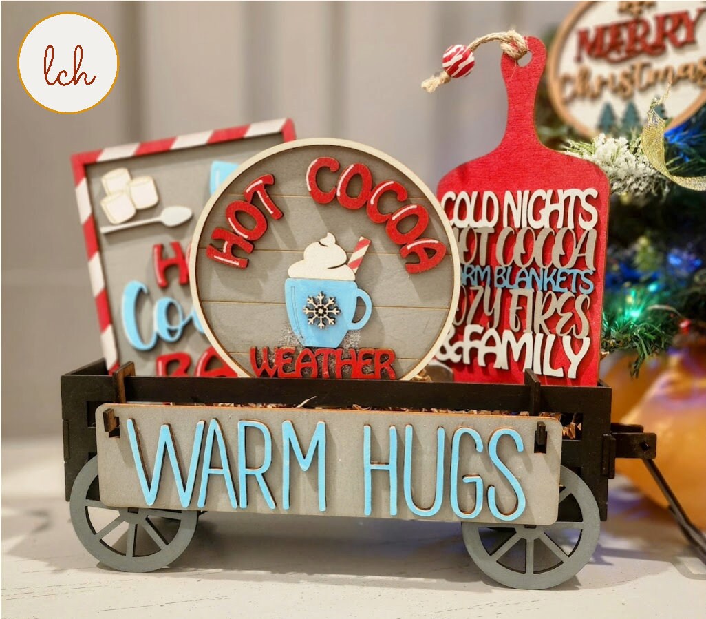 Wooden wagon insert with warm hugs sign and hot cocoa themed decorative wooden pieces